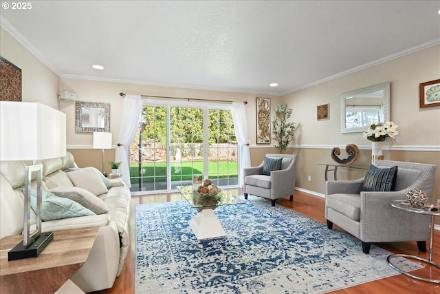 living room with plenty of natural light, crown molding, and wood finished floors