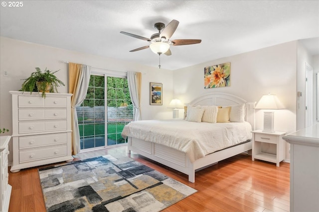 bedroom featuring ceiling fan, access to outside, and light wood-style flooring