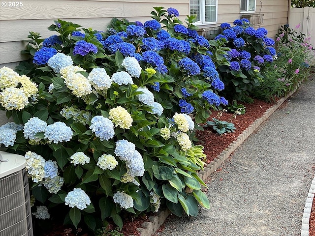 exterior details with central AC unit and fence