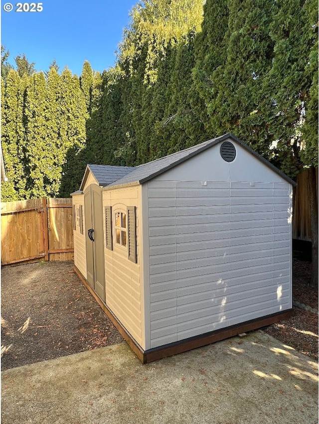 view of shed featuring a fenced backyard