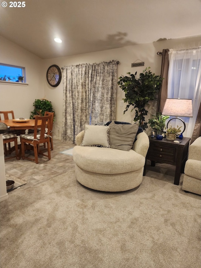 carpeted living area with recessed lighting