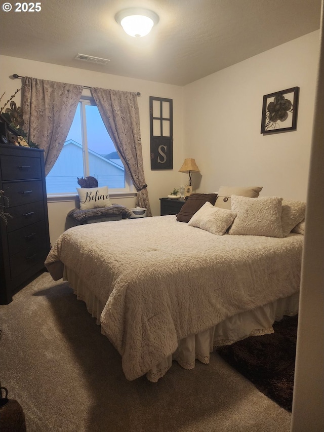 bedroom with carpet flooring and visible vents