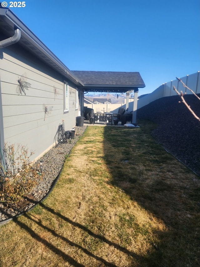 view of yard with a patio area and a fenced backyard