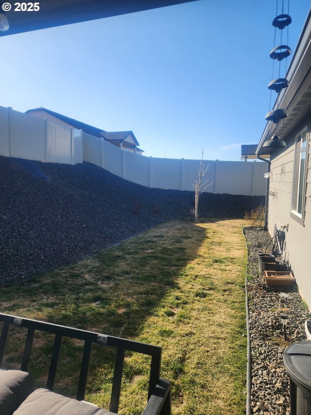 view of yard with a fenced backyard