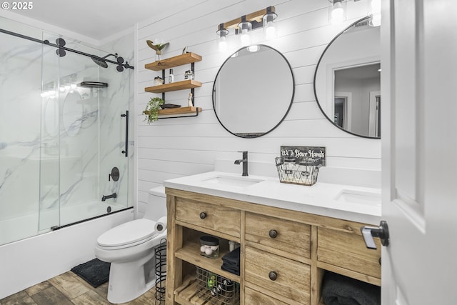 5212 NE 281st Ave, Camas, WA 98607 - bathroom featuring toilet, wood finished floors, bath / shower combo with glass door, double vanity, and wood walls