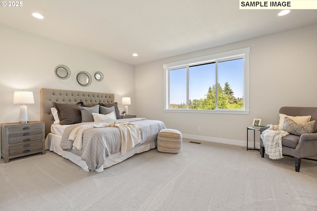 carpeted bedroom with recessed lighting, visible vents, and baseboards