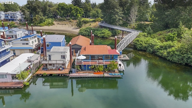 bird's eye view featuring a water view and a residential view