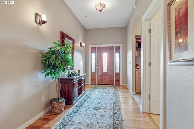 foyer entrance with light hardwood / wood-style floors