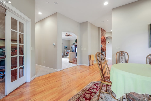 dining room featuring light hardwood / wood-style floors and ceiling fan