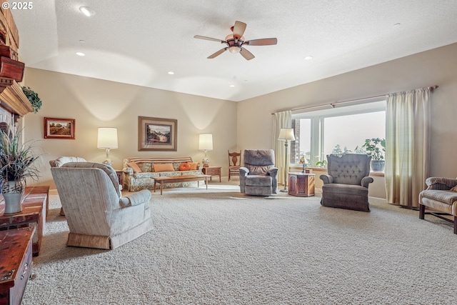 living room featuring ceiling fan, a textured ceiling, lofted ceiling, and carpet flooring