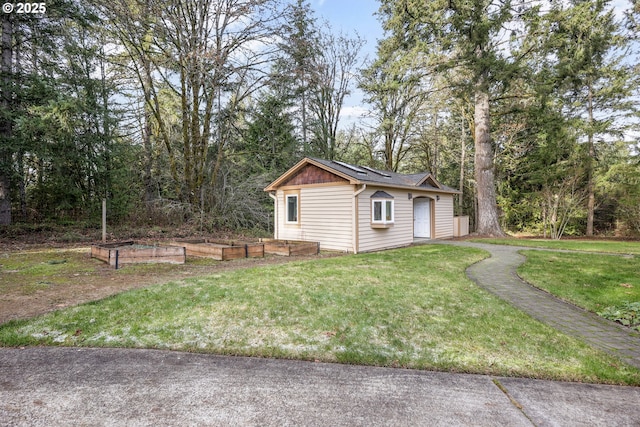 view of side of property with a lawn