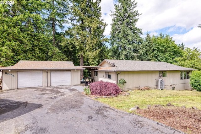 32505 Viewcrest Dr, Warren, OR 97053 - single story home featuring a front yard, a garage, and a shingled roof