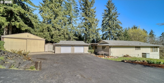 32505 Viewcrest Dr, Warren, OR 97053 - view of front of home with driveway and a garage
