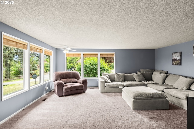 32505 Viewcrest Dr, Warren, OR 97053 - living room with carpet flooring, ceiling fan, a textured ceiling, and baseboards
