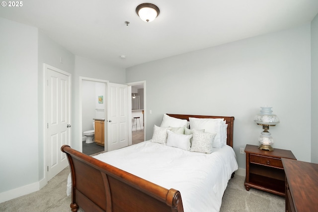1108 S Holladay Dr Unit 24, Seaside, OR 97138 - bedroom with light carpet and ensuite bath