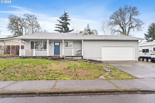 ranch-style home with a garage, driveway, a chimney, covered porch, and a front yard