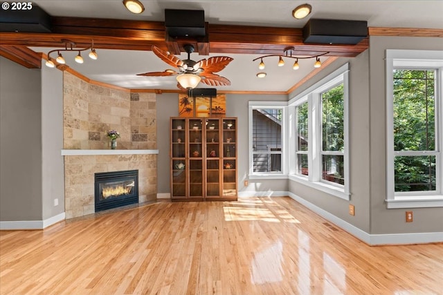 7444 SE 114th Ave, Portland, OR 97266 - unfurnished living room with wood finished floors, baseboards, a ceiling fan, crown molding, and a fireplace