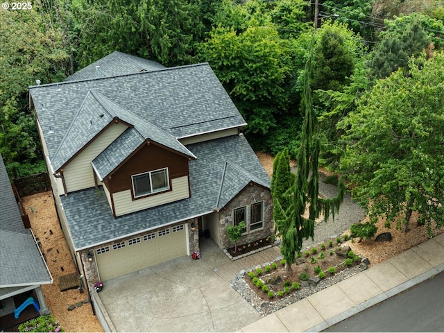 7444 SE 114th Ave, Portland, OR 97266 - view of front of home with stone siding, roof with shingles, and driveway