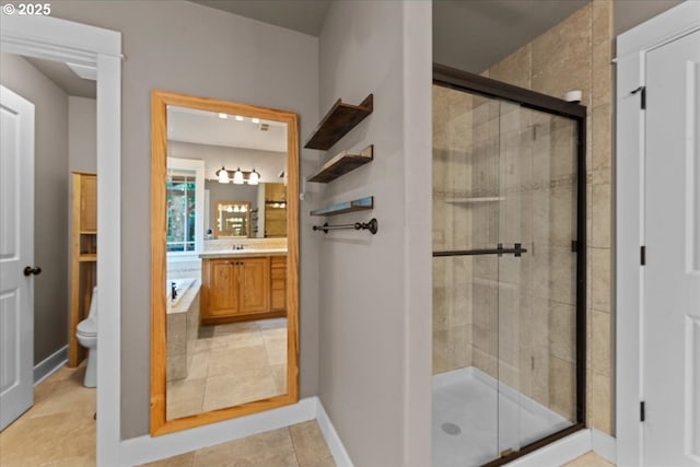 7444 SE 114th Ave, Portland, OR 97266 - bathroom with toilet, vanity, a stall shower, and baseboards