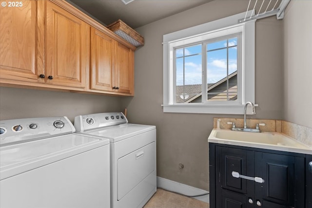 7444 SE 114th Ave, Portland, OR 97266 - laundry room with washing machine and dryer, cabinet space, baseboards, and light tile patterned floors