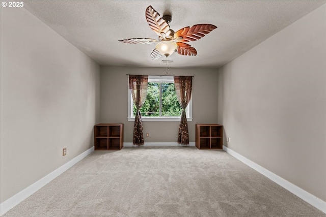7444 SE 114th Ave, Portland, OR 97266 - carpeted spare room with a textured ceiling, ceiling fan, and baseboards