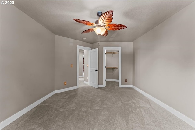 7444 SE 114th Ave, Portland, OR 97266 - unfurnished bedroom featuring carpet, baseboards, a spacious closet, a closet, and a ceiling fan