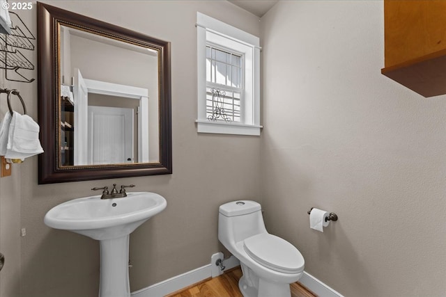 7444 SE 114th Ave, Portland, OR 97266 - half bath featuring baseboards, toilet, and wood finished floors