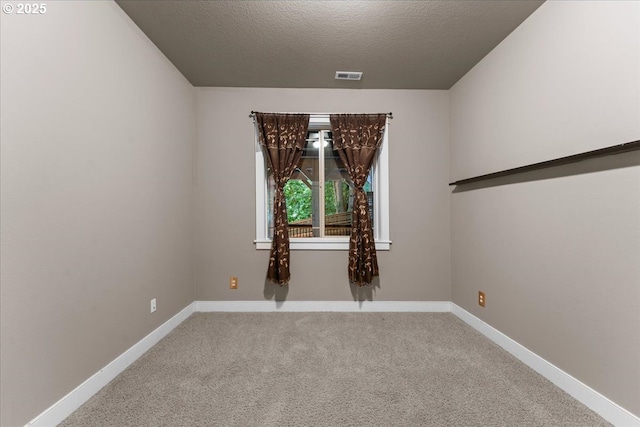 7444 SE 114th Ave, Portland, OR 97266 - carpeted spare room with a textured ceiling and baseboards