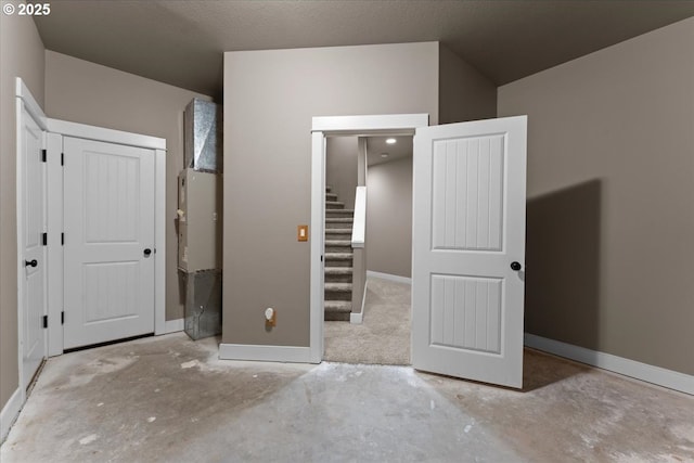 7444 SE 114th Ave, Portland, OR 97266 - unfurnished bedroom with baseboards and concrete floors