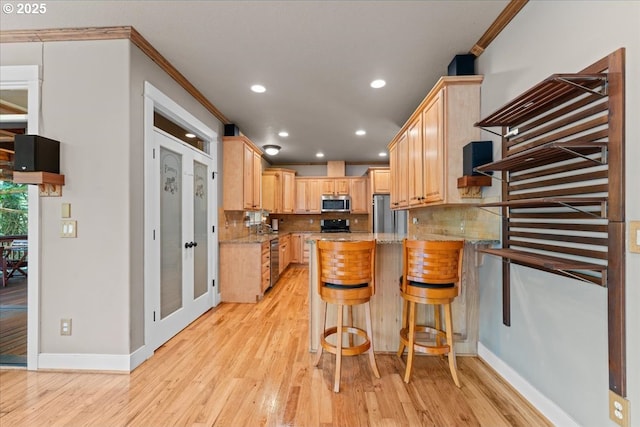 7444 SE 114th Ave, Portland, OR 97266 - kitchen featuring stainless steel appliances, light brown cabinets, decorative backsplash, ornamental molding, and baseboards