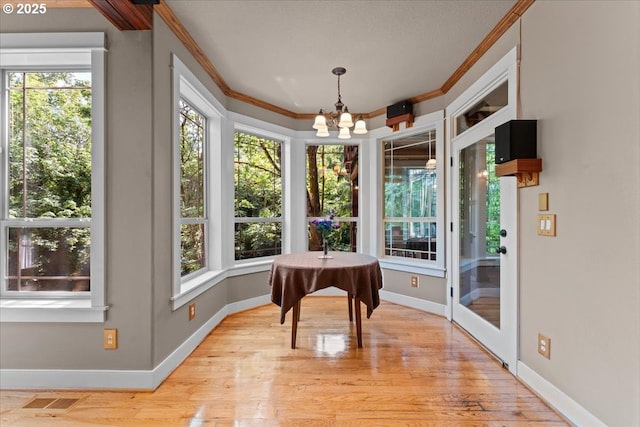 7444 SE 114th Ave, Portland, OR 97266 - dining area with ornamental molding, healthy amount of natural light, a chandelier, and baseboards