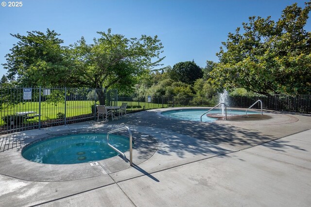 11255 SW Chickadee Ter, Beaverton, OR 97007 - view of swimming pool with a hot tub and a patio area