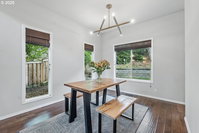 11255 SW Chickadee Ter, Beaverton, OR 97007 - dining space with a chandelier, plenty of natural light, baseboards, and dark wood-type flooring