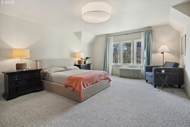 bedroom with radiator and vaulted ceiling