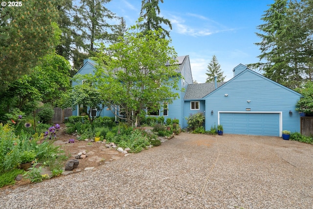 11924 SW 34th Ave, Portland, OR 97219 - view of front of home featuring a garage, concrete driveway, and roof with shingles
