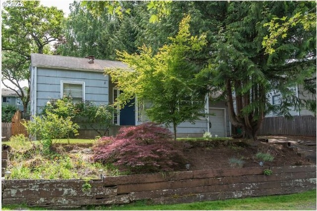 view of front of house featuring fence