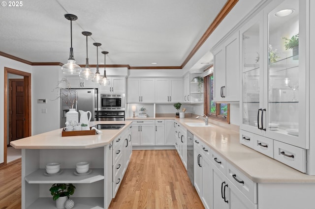 10670 NW La Cassel Crest Ln, Portland, OR 97229 - kitchen with open shelves, stainless steel appliances, light wood-style flooring, ornamental molding, and white cabinetry