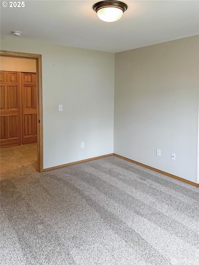 510 Oregon Ave N, Long Beach, WA 98631 - spare room featuring carpet and a smoke detector