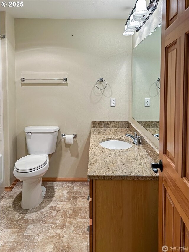510 Oregon Ave N, Long Beach, WA 98631 - bathroom with vanity and stone finish floors