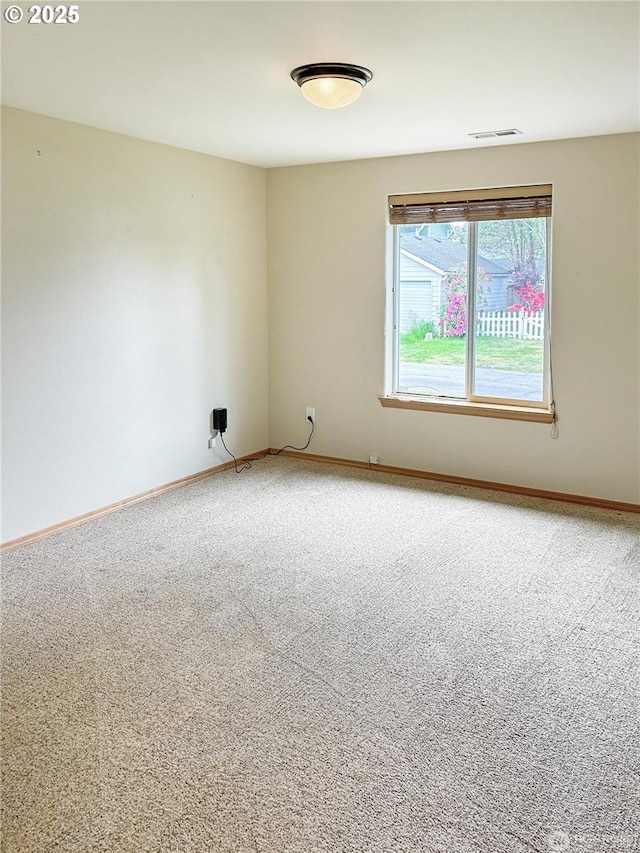 510 Oregon Ave N, Long Beach, WA 98631 - spare room featuring carpet flooring and baseboards