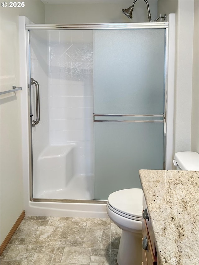 510 Oregon Ave N, Long Beach, WA 98631 - bathroom with vanity, a stall shower, and stone finish flooring