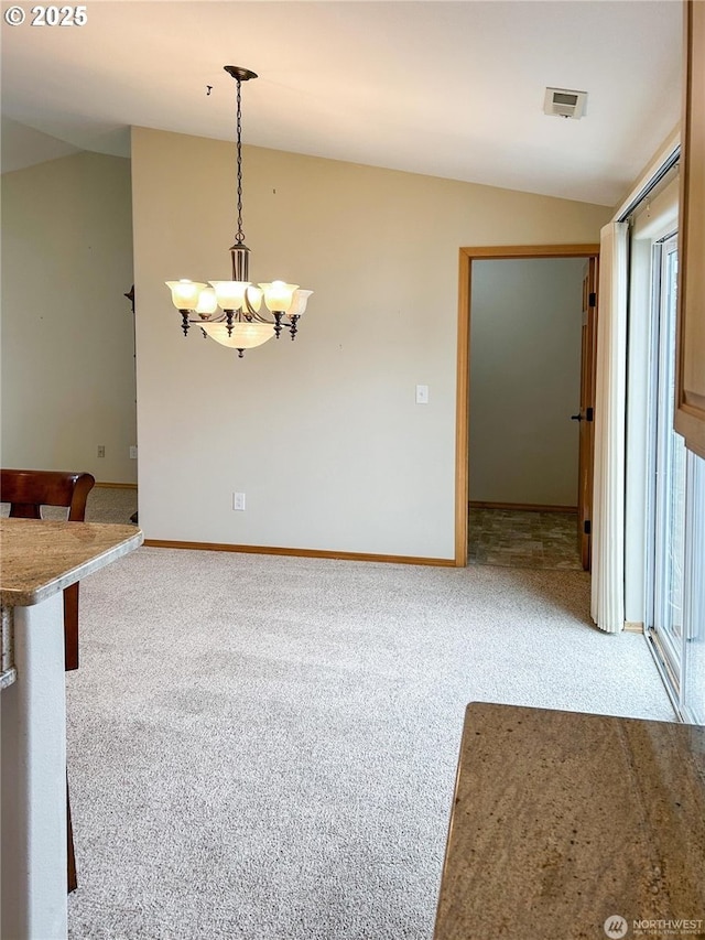 510 Oregon Ave N, Long Beach, WA 98631 - unfurnished dining area with light colored carpet, a chandelier, and lofted ceiling