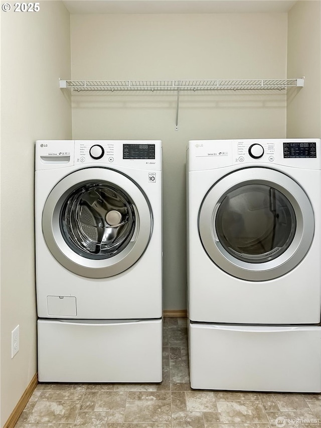 510 Oregon Ave N, Long Beach, WA 98631 - washroom with washer and dryer and stone finish floors