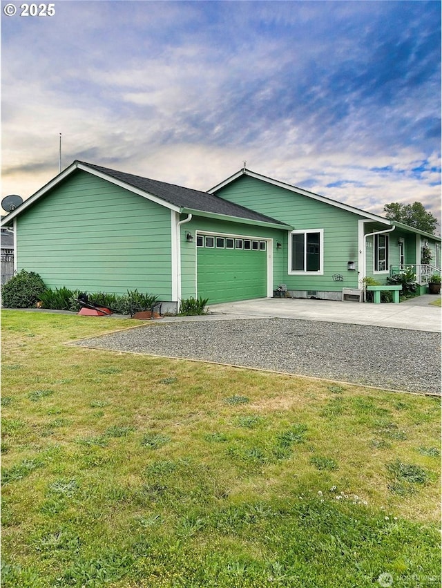 510 Oregon Ave N, Long Beach, WA 98631 - view of home's exterior with a garage, driveway, and a lawn