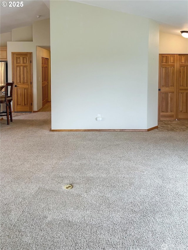 510 Oregon Ave N, Long Beach, WA 98631 - carpeted spare room featuring baseboards and vaulted ceiling