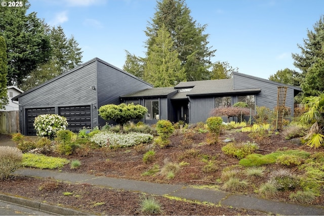 mid-century inspired home featuring an attached garage