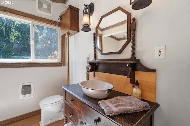 3412 NE 399th St, La Center, WA 98629 - bathroom with toilet, heating unit, vanity, and baseboards