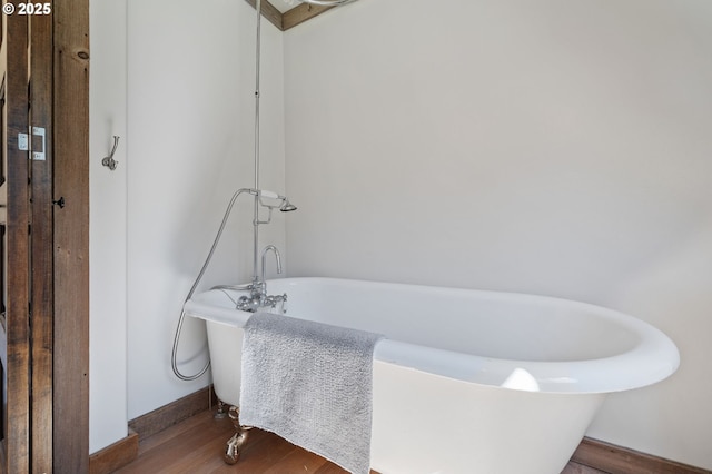 3412 NE 399th St, La Center, WA 98629 - bathroom with wood finished floors, a soaking tub, and baseboards