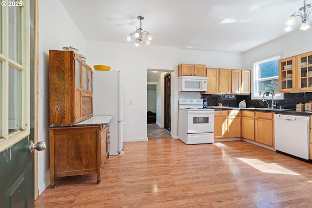 3412 NE 399th St, La Center, WA 98629 - kitchen with white appliances, a chandelier, decorative backsplash, and light wood-style floors