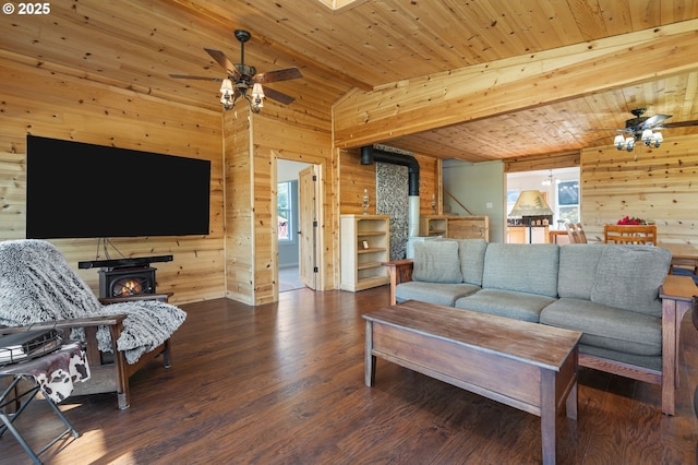 3412 NE 399th St, La Center, WA 98629 - living room with wooden walls, lofted ceiling, ceiling fan, a wood stove, and wood finished floors